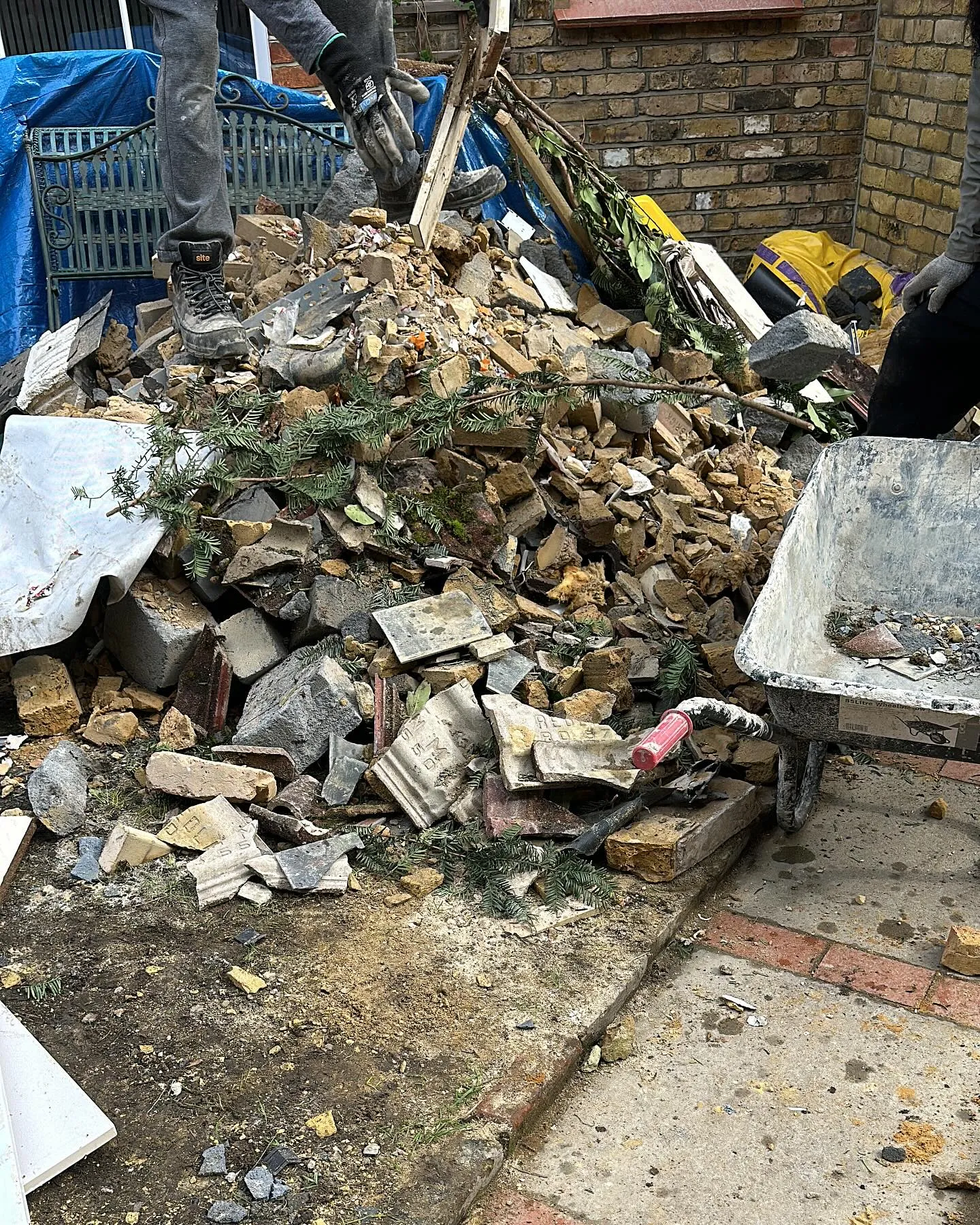 A pile of rubble sitting on top of a sidewalk.