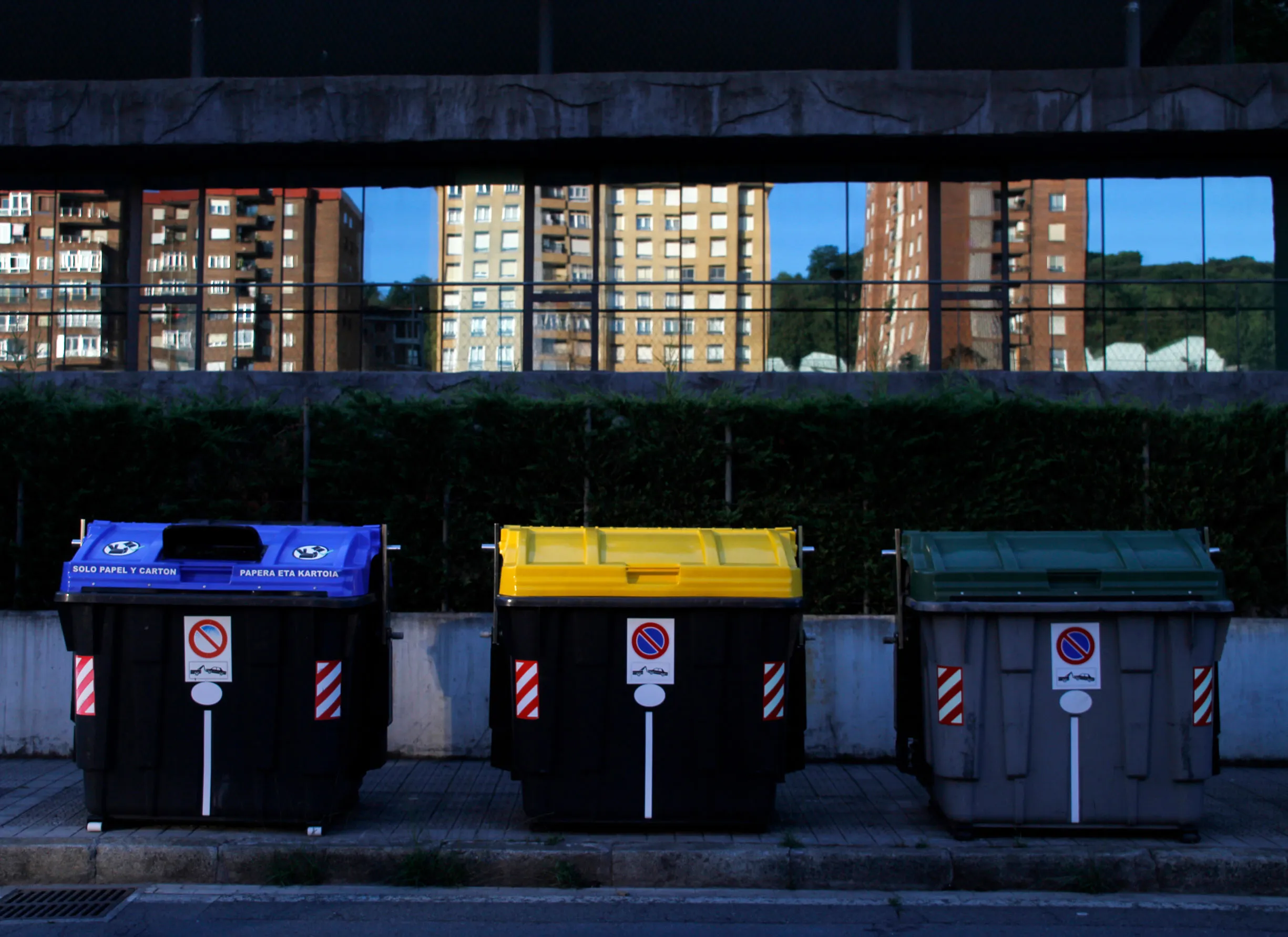 Three Waste Bins on the side of the street